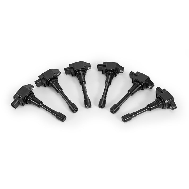Mishimoto stock replacement ignition coil set for 2009-2020 Nissan 370Z, six ignition coils with black plastic covers and electrical connectors.