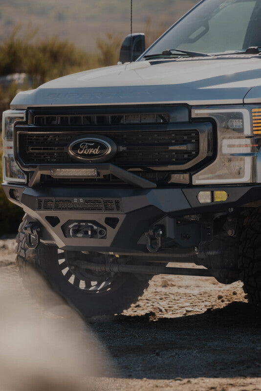 Steel front bumper for Ford Super Duty F-250 and F-350 by DV8 Offroad, designed for durability and off-road protection.