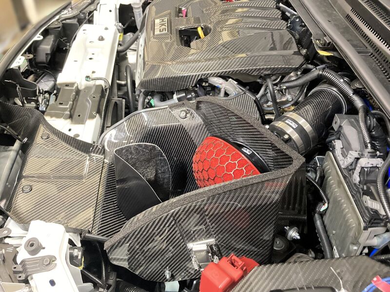 HKS cold air intake full kit for GZEA14H, showing the black air filter, intake pipe, and mounting components on a white background.