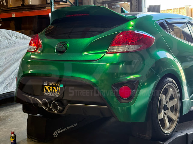 Hyundai Veloster Turbo 2013-2018 exhaust axle back with dual 4-inch muffler delete, featuring burnt tips or chrome finish.
