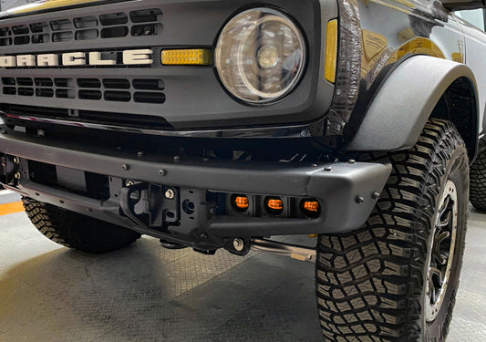 Oracle Lighting Ford Bronco triple LED fog light kit installed on steel bumper, showcasing bright, high-performance off-road fog lights.