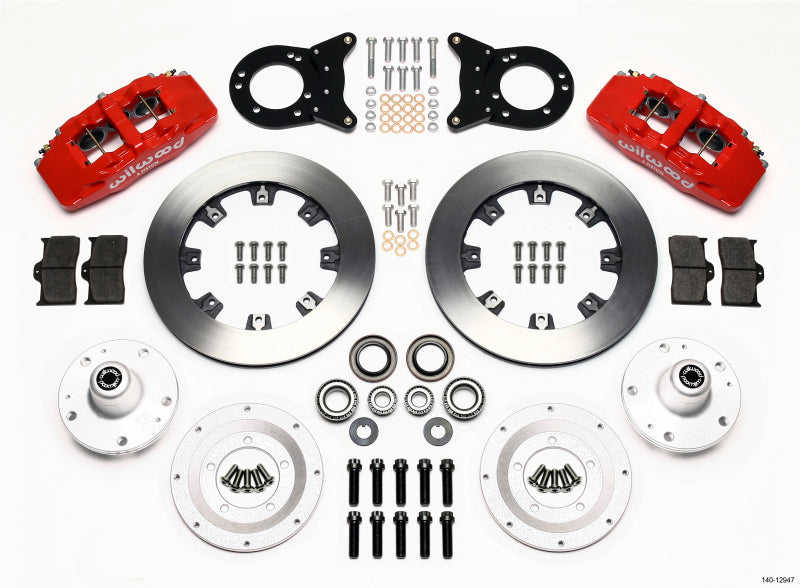 Wilwood Dynapro 6 front hub kit with red brake calipers on a 1965-1969 Mustang spindle, featuring disc and drum brake components.