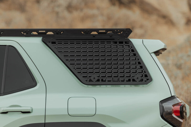 DV8 Offroad exterior trim window molle for Toyota 4Runner 25-26 model, designed for DV8 roof rack on driver side.