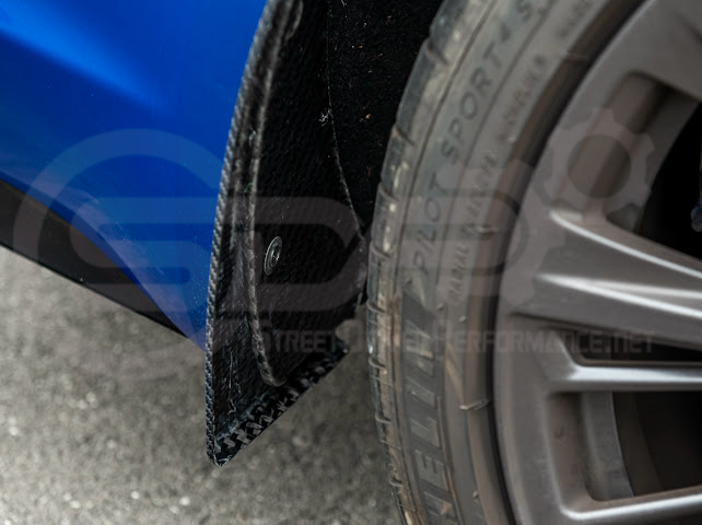 Pair of black carbon fiber front and rear mud flaps for 2022-up Cadillac CT5-V Blackwing by Street Driven Performance.