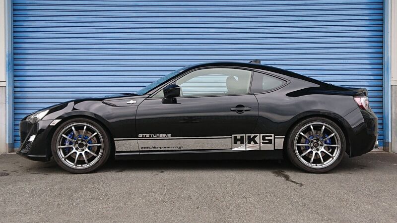 HKS HIPERMAX S coilover kit installed on a Nissan ZN6, showing the adjustable suspension components and sporty design.