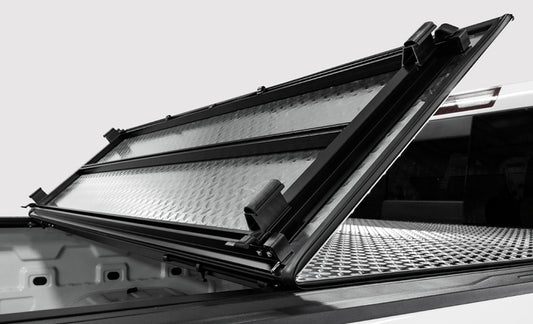 Access Tonneau Cover for Ram 1500 6ft 4in bed, hard fold, urethane diamond plate finish, tri-fold design, truck bed protection.