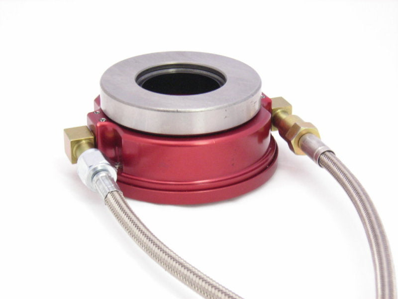 McLeod Racing slip-on release bearing with elbow fittings and adjustable screw for Ford and MOPAR vehicles.