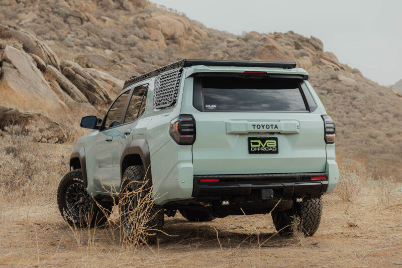 DV8 Offroad Toyota 4Runner exterior window molle panel for DV8 roof rack, driver side, mounted on vehicle window area.