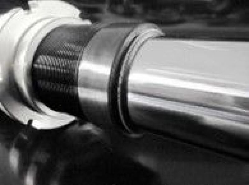 HKS Hipermax S coilover kit installed on a 2022+ Tesla Model Y AWD, showing the adjustable shock absorbers and suspension components.