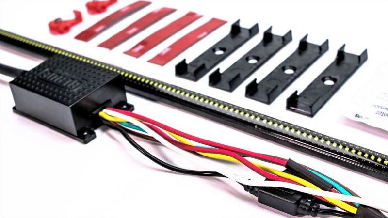 Putco 17-19 Ford Super Duty 60-inch Amber Blade LED Light Bar mounted on tailgate with quick-connect harness for enhanced visibility.