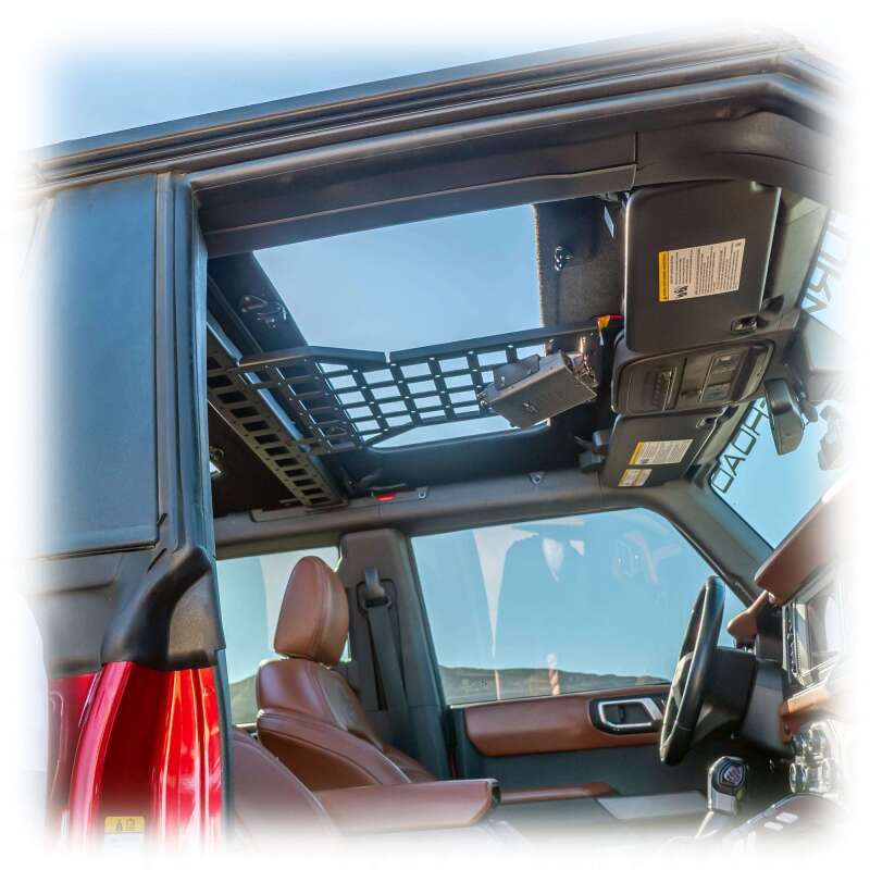 Turn Offroad Ford Bronco 2021+ cage brace with Molle pattern and center mount, mounted on vehicle interior for utility and organization.