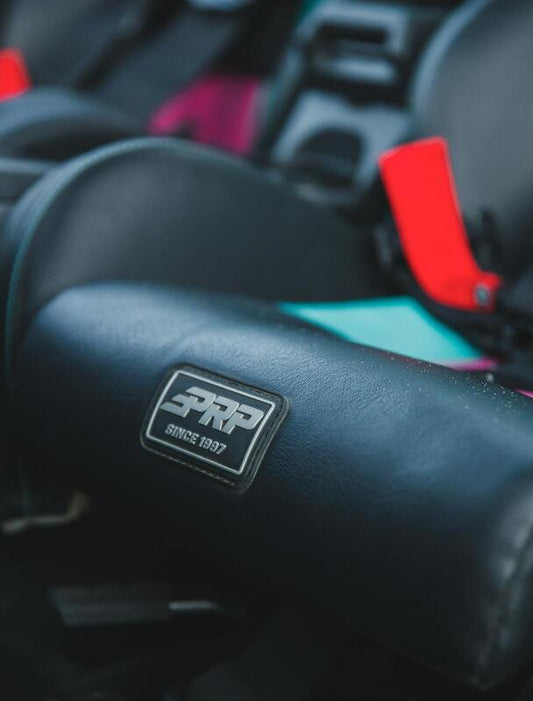 PRP Seats PRP XCR Suspension Seats Kit for Can-Am Maverick X3, pair in black and gray, showing cushioned seat design with suspension features.