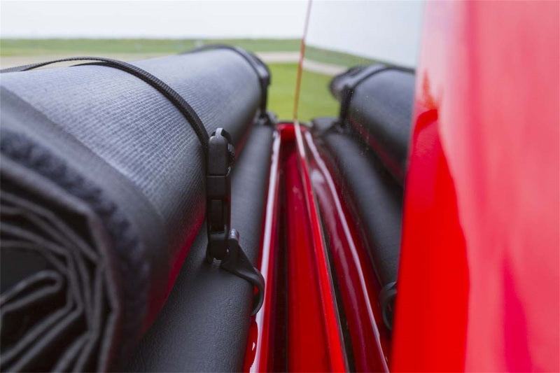 Access Limited roll-up truck bed cover on a Dodge Dakota Crew Cab with utility rail, designed for 5ft 4in beds.