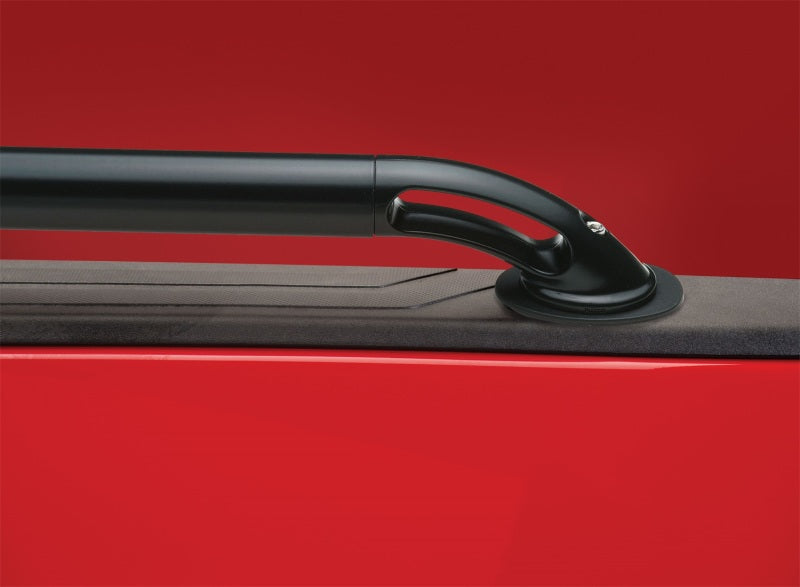 Putco black powder-coated 6.5ft bed locker side rails on Toyota Tundra truck exterior, body armor and rock rails for pickup bed protection.