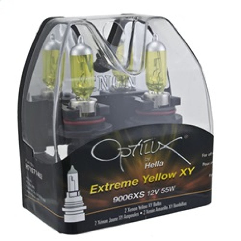 Hella 9006Xs 12V 55W Xen Pure Yellow bulbs, car headlight bulbs, shown in their packaging or installed in a vehicle headlight.