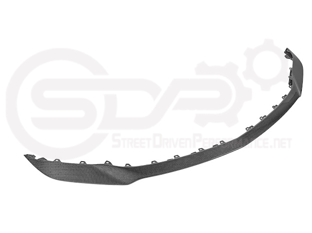 Cadillac CT5-V Blackwing factory OEM style carbon fiber front lip splitter with ground effects and wheel arches, installed on the vehicle.
