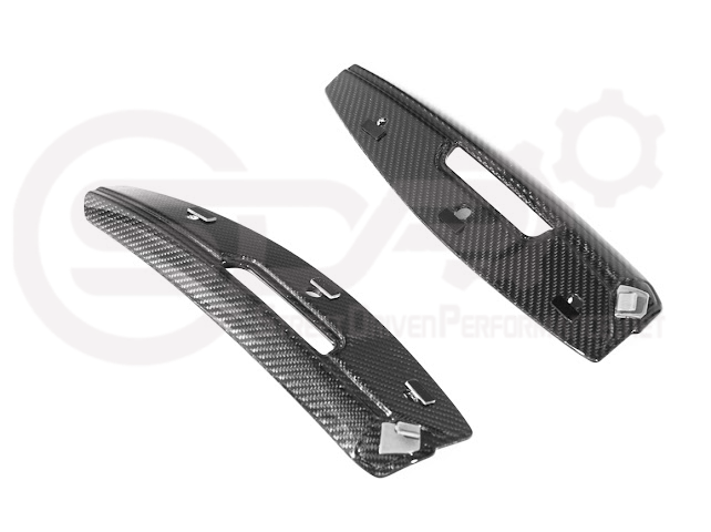 Cadillac CT5-V Blackwing factory OEM style carbon fiber front lip splitter and wheel arches on a sporty sedan.