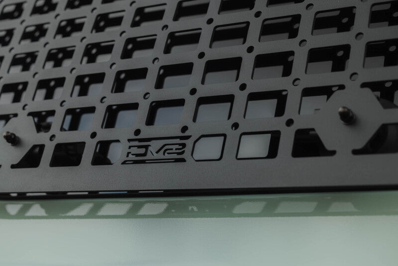 DV8 Offroad Toyota 4Runner exterior window Molle panel for DV8 roof rack on driver side, part of the vehicle's exterior trim.