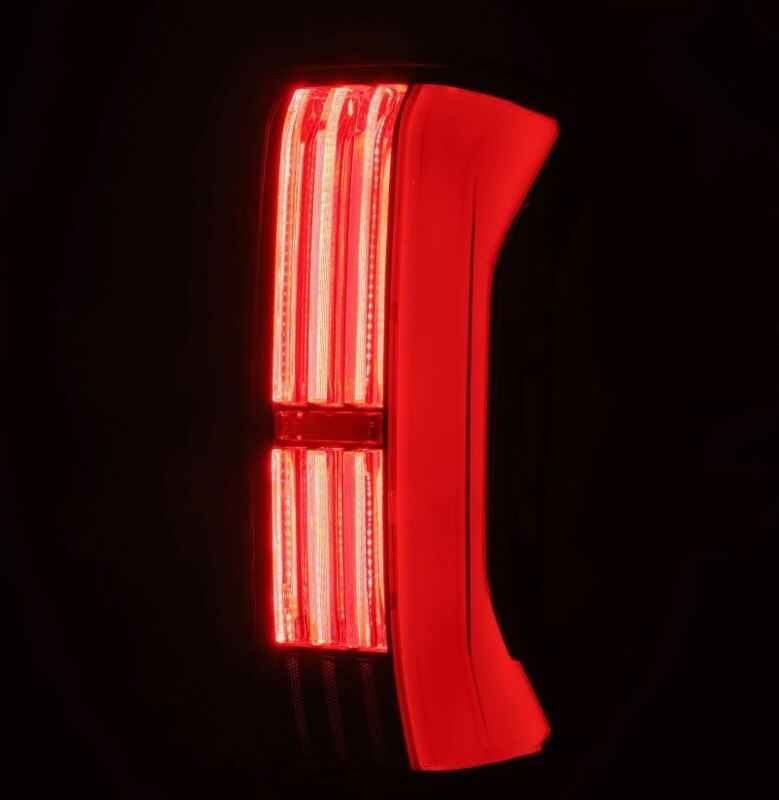 AlphaRex Nova-Series LED tail lights for Toyota Tundra 22-24 in black and red, showing the prismatic lens design and tail light assembly.