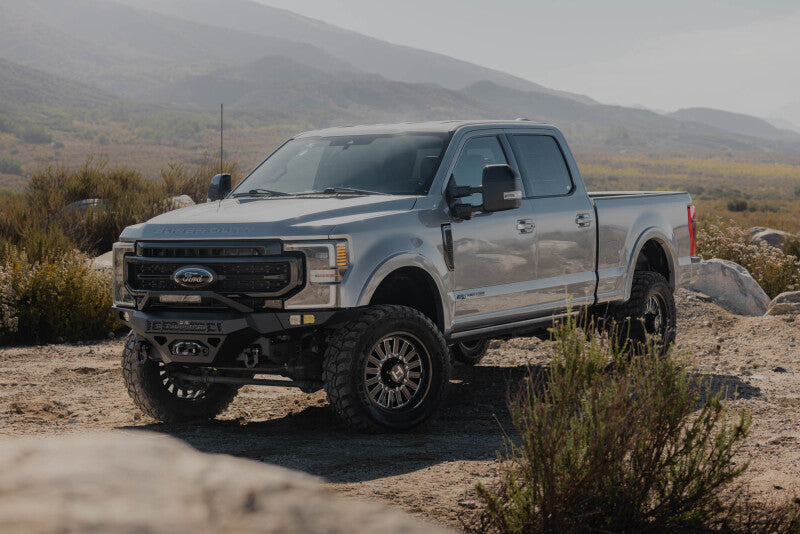 Steel front bumper for Ford Super Duty F-250/F-350 from DV8 Offroad, durable off-road bumper with heavy-duty construction.