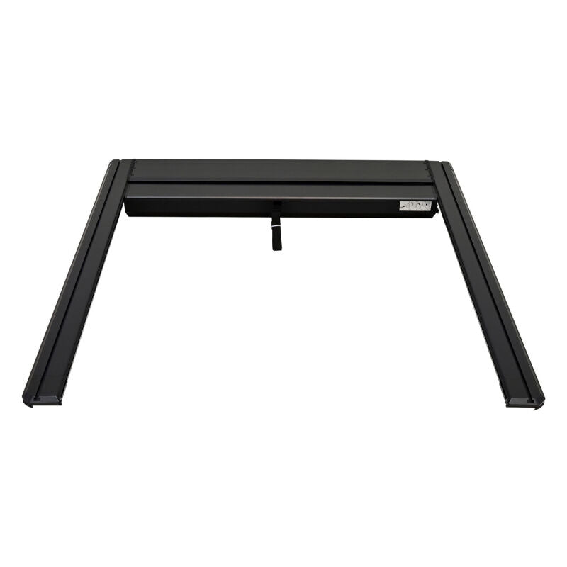 Black Westin manual retractable tonneau cover on a Toyota Tundra 5.5ft bed, roll-up style for secure truck bed coverage.