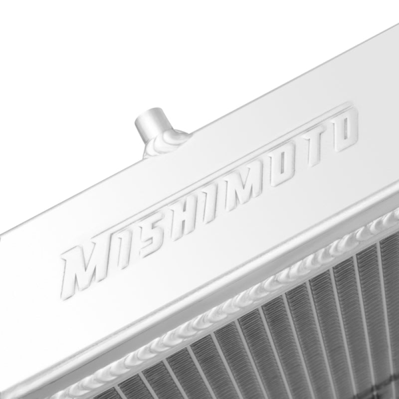 Mishimoto aluminum radiator for 1991-1999 Mitsubishi 3000GT Turbo, showing the sleek metallic core and mounting fittings.