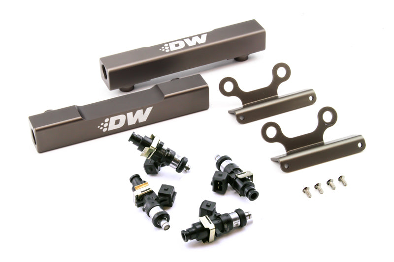 DeatschWerks 02+ Subaru WRX and 07+ STI fuel rail upgrade kit with 1500cc injectors, showing top feed fuel rails and injectors installed.