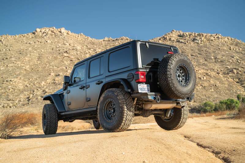 DV8 Offroad Jeep Wrangler JL MTO Series bumper spare tire swing gate tailgate accessory showing the bumper with mounted spare tire.