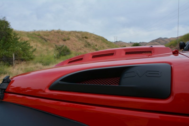 DV8 Offroad Jeep Wrangler JK metal heat dispersion hood in primer black, designed for 2007-2018 Jeep JK models.