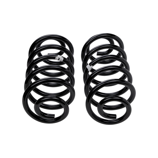 Old Man Emu ARB/OEM coilover springs for rear Jeep TJ, durable coil spring suspension component, black finish, mounted on vehicle.