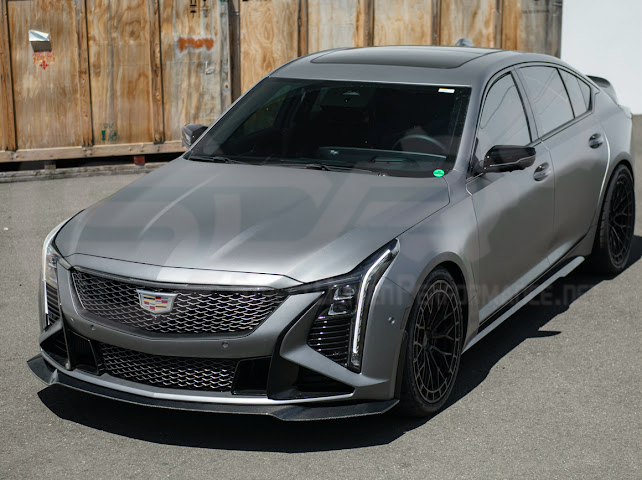 Cadillac CT5-V Blackwing factory OEM style carbon fiber front lip splitter and wheel arches, ground effects for enhanced sporty appearance.