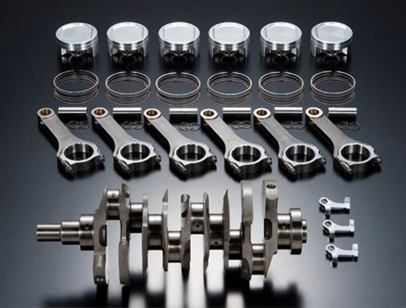 HKS VR38 4.3L STEP Pro forged piston set for 4-cylinder engines, showing precision-machined pistons with HKS branding.