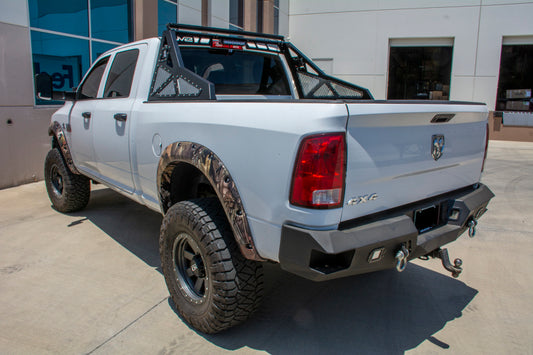 DV8 Offroad chase rack installed on 2010-2018 Ram 2500/3500 pickup truck, heavy-duty bolt-on design for off-road protection.