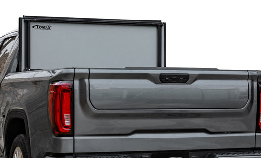 Access 2022+ Toyota Tundra 5ft 6in Bed LOMAX Stance folding hard cover made of urethane and aluminum, shown in closed position.