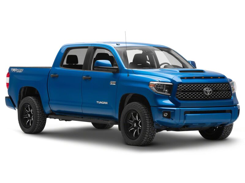 Raxiom 14-21 Toyota Tundra 5-LED grille light accessory installed on front grille for enhanced visibility and style.