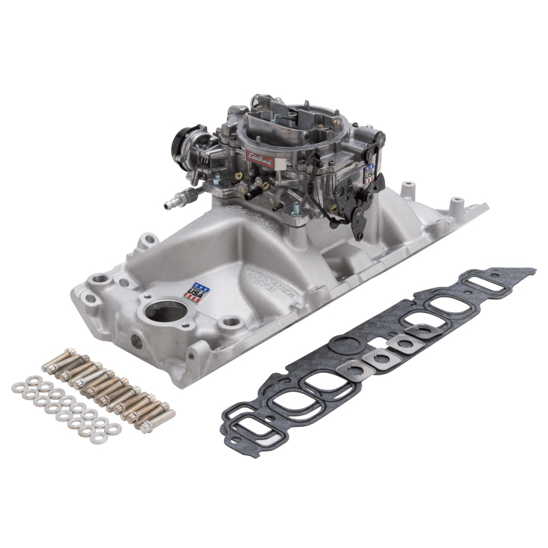 Edelbrock Performer RPM big block Chevrolet oval port intake manifold and carburetor kit in natural finish, shown with installed components.