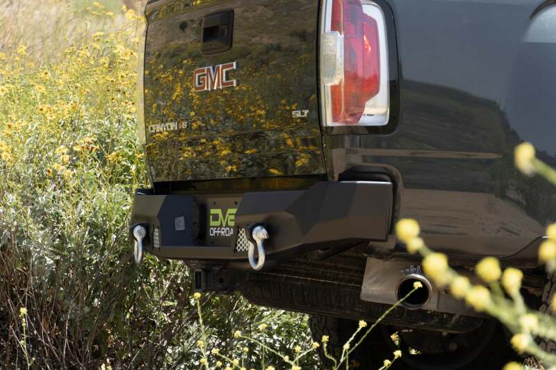 Steel rear bumper from DV8 Offroad MTO Series for Chevy Colorado and GMC Canyon 2014-2022, rugged off-road design.