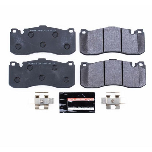 PowerStop racing front brake pads for BMW 135i (2008-2013) with high-performance friction material and vented design for track use.