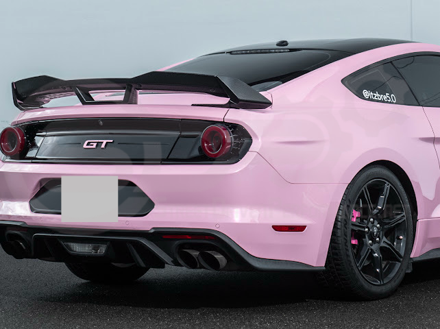 Dark Horse style carbon fiber rear wickerbill spoiler wing on a 2015-2023 Ford Mustang, showcasing sleek aerodynamic design.