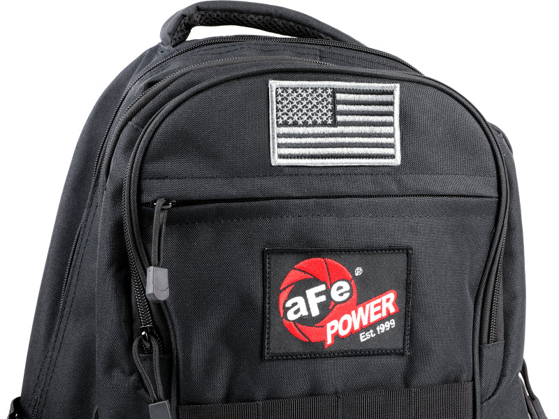 Black aFe Power lightweight tactical backpack with USB charging port, featuring multiple compartments and durable design for outdoor use.