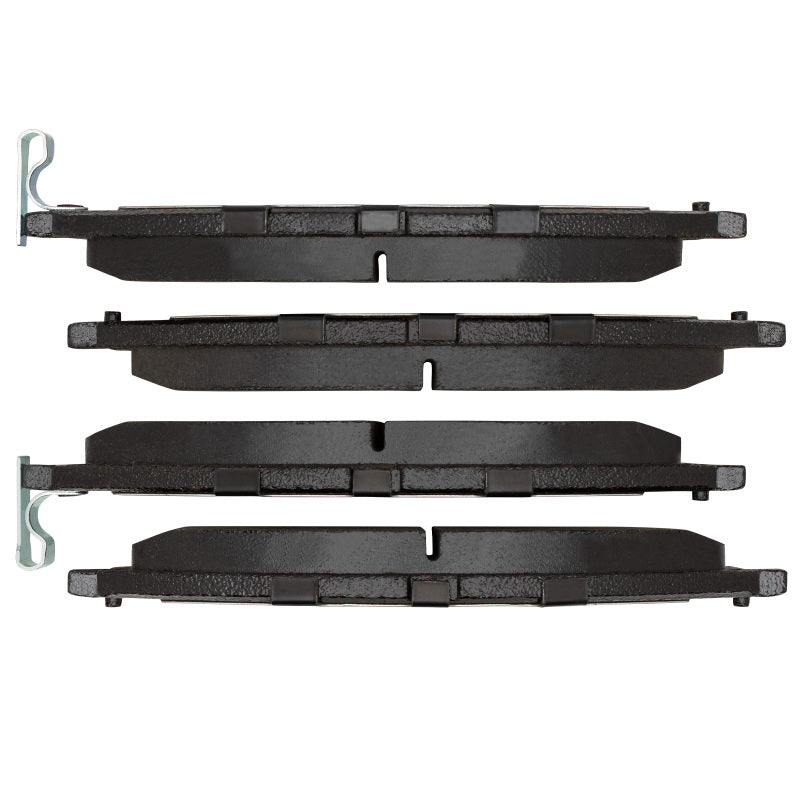 Nissan XTerra front ceramic brake pads by R1 Concepts, OE style, with visible metal backing and brake pad friction material.