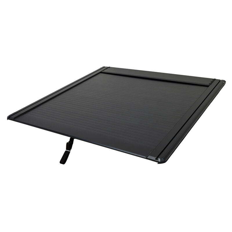 Westin manual retractable tonneau cover in black on a 22-26 Toyota Tundra 5.5ft bed, roll-up style for truck bed protection.