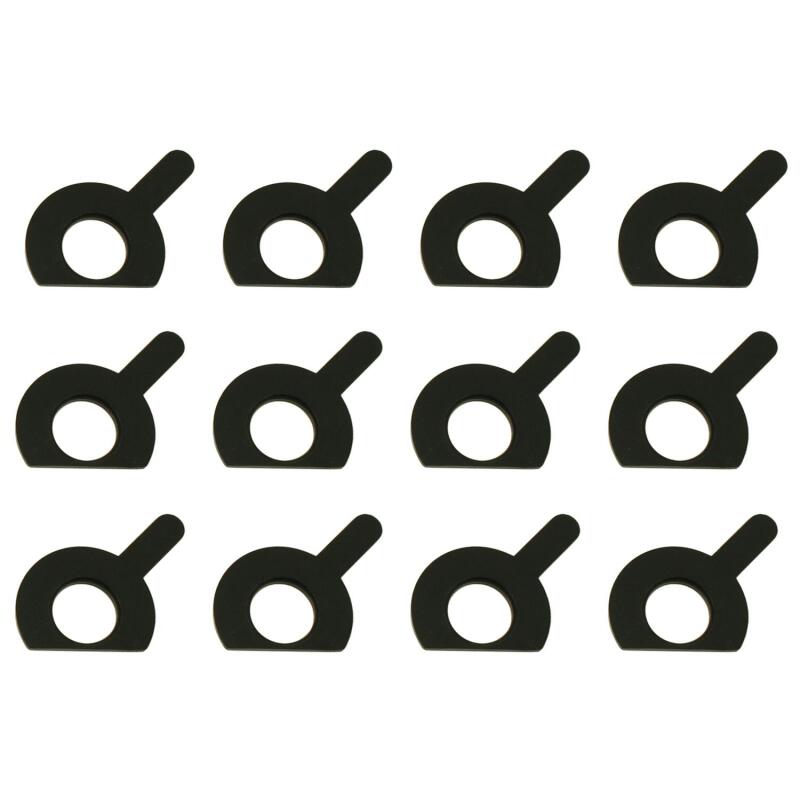Moog brake caliper alignment spacer kit for suspension alignment, showing metal shims and tools for precise brake caliper positioning.
