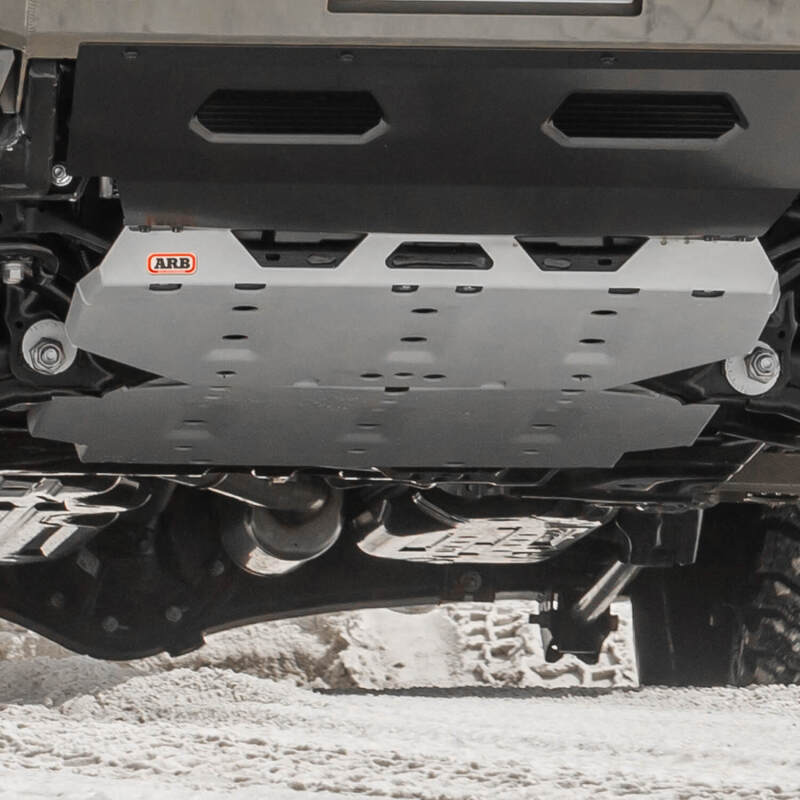 ARB 2024+ Toyota Tacoma front skid plate, durable metal protection for off-road vehicles, shown mounted on the truck's underside.