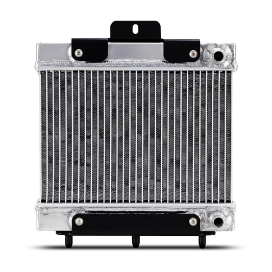 Mishimoto performance auxiliary radiator for BMW F8X M3 M4 models, showing the sleek aluminum core and fitting connections.
