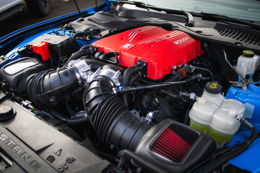 Roush 2026 Ford Mustang 5.0L supercharger kit with 810 HP, featuring the supercharger unit and installation components.