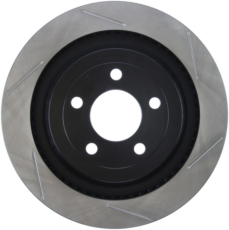 StopTech slotted brake rotor for 2015 Ford Mustang GT with Brembo brakes, left rear view showing ventilated disc design.