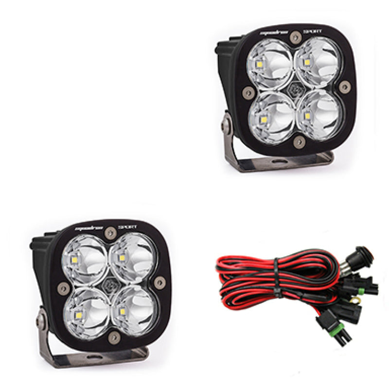 Baja Designs Squadron Sport LED work and scene light pods, clear lens, mounted on off-road vehicle for enhanced illumination.