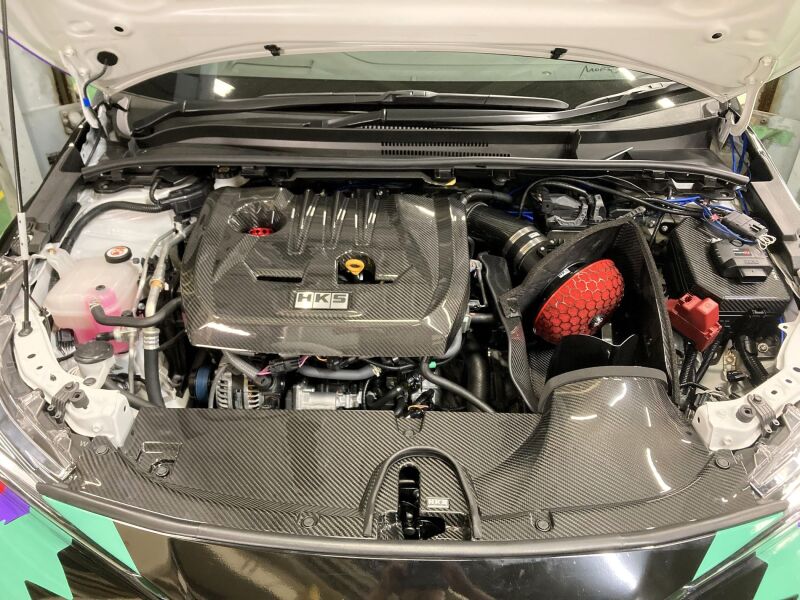 HKS cold air intake full kit for GZEA14H, showing the black and blue intake piping and air filters on a car engine.