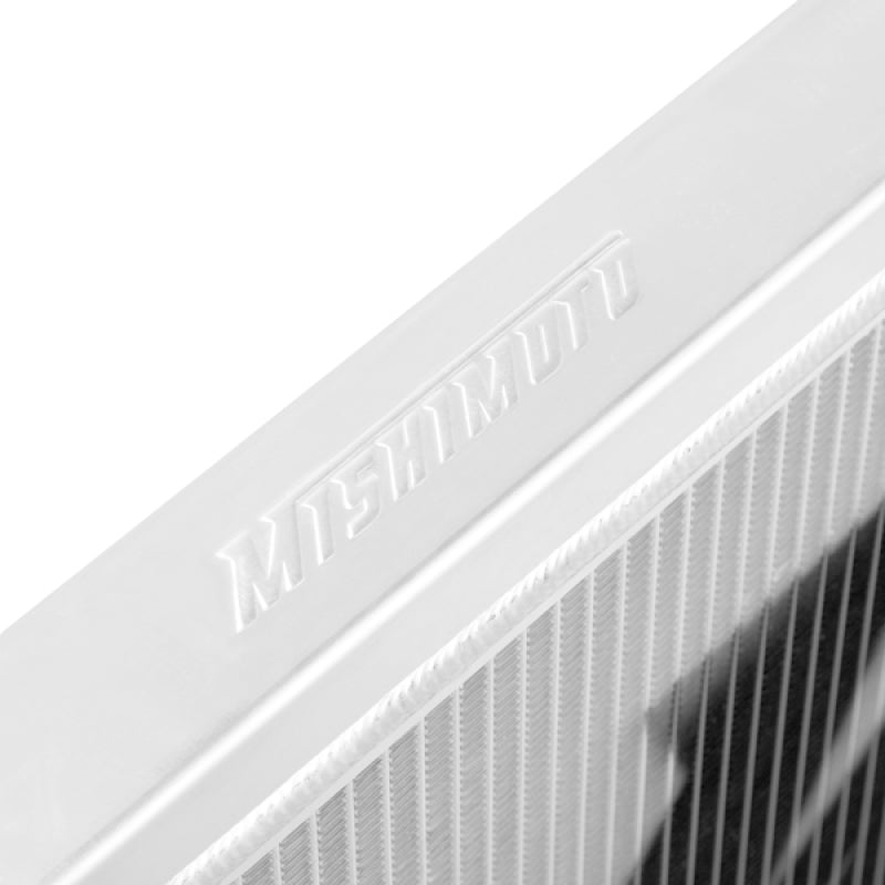 Mishimoto aluminum radiator for 2003-2006 Nissan 350Z manual transmission, with cooling fins and mounting brackets visible.